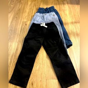 3 pair of boy pants different sizes.